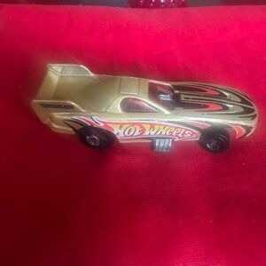 Gold Race Car Toy by Mattel Inc. Made in Malaysia in 1977.